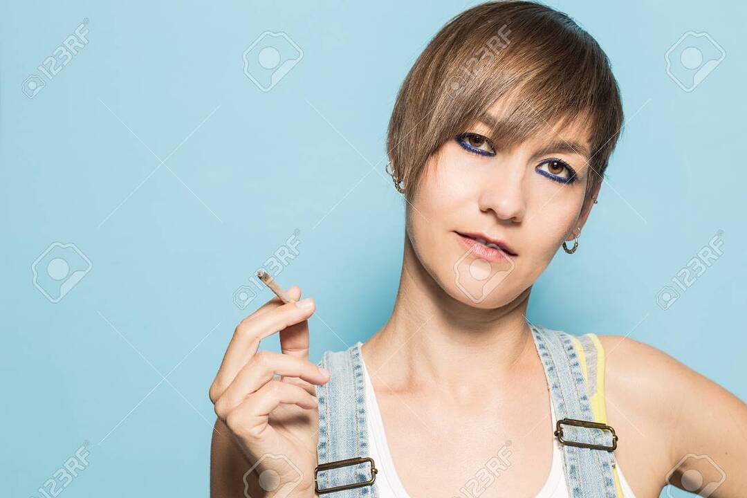 101470682-normal-woman-with-short-hair-smoking-social-network-style-photography